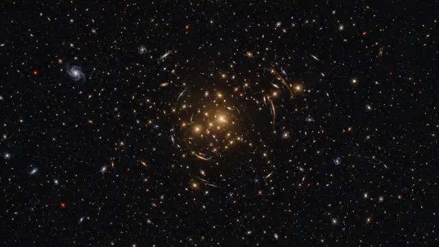 Vasto campo de estrellas y galaxias en el espacio profundo